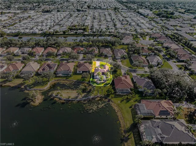 View of property location featuring a large body of water and nearby suburban area