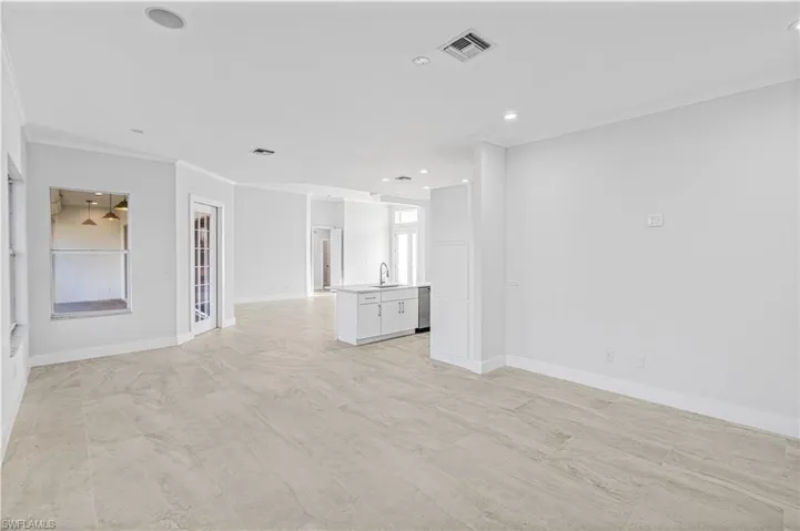 Spare room featuring ornamental molding and recessed lighting