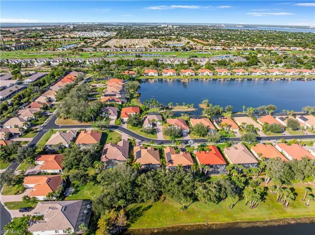 Aerial overview of property's location featuring a large body of water and nearby suburban area