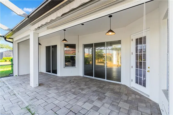 View of patio / terrace with a sunroom