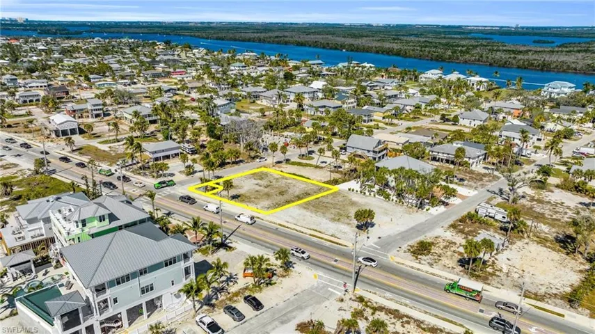 Your coastal dream begins here! Prime vacant lot offers incredible potential for a custom home with convenient access to both the beach and bay waters - Virtually Edited Image