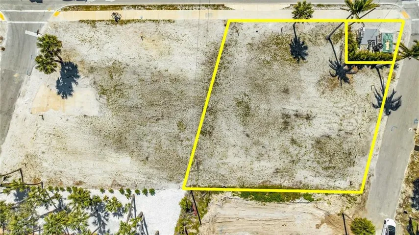 Front-row seats to paradise! Exceptional vacant lot, directly across from the shimmering white sands - Virtually Edited Image