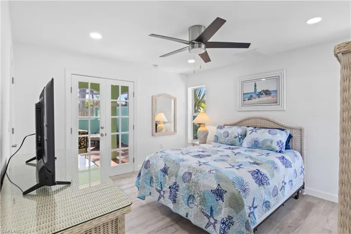 Double door entryway and an additional access as well as a private bathroom and closet!  A perfect guest room or private suite /office / studio / exercise room!
