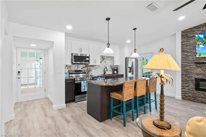 Wide angle of the kitchen - plenty of cabinet and counter space!