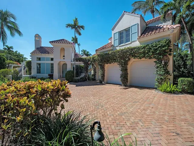 Mediterranean / spanish-style house with a garage