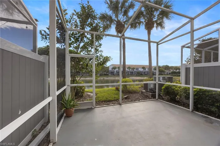 Unfurnished sunroom with a water view and healthy amount of natural light