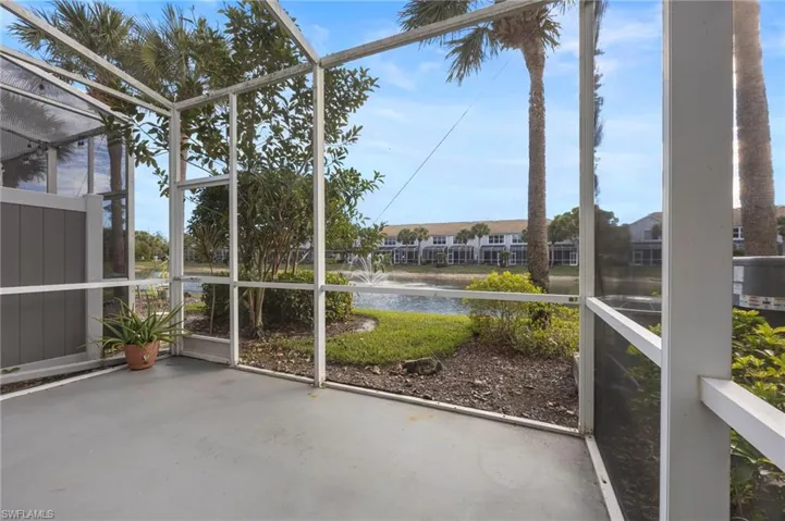 Unfurnished sunroom with a water view and healthy amount of natural light