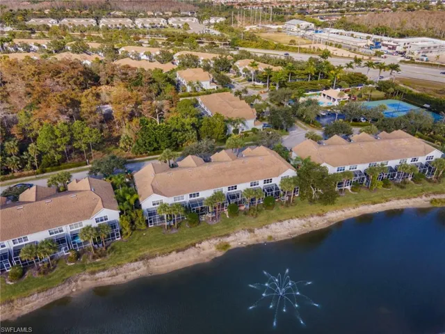 Aerial view of property's location with a nearby body of water