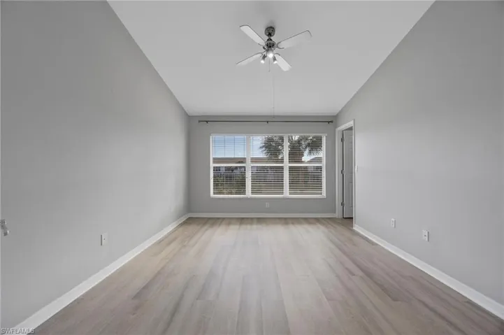 Spare room with light wood-type flooring and ceiling fan