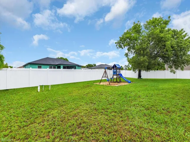 View of yard featuring a playground