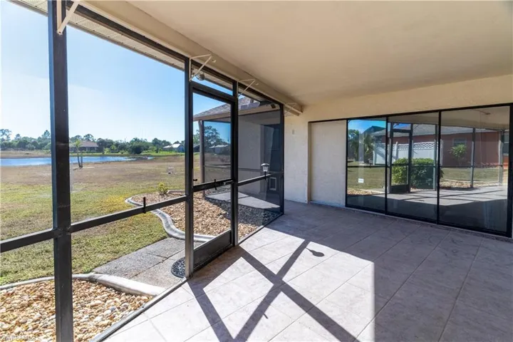 Unfurnished sunroom with a water view and healthy amount of natural light