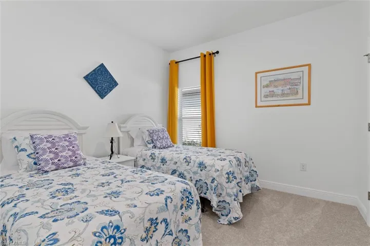 Carpeted bedroom with baseboards