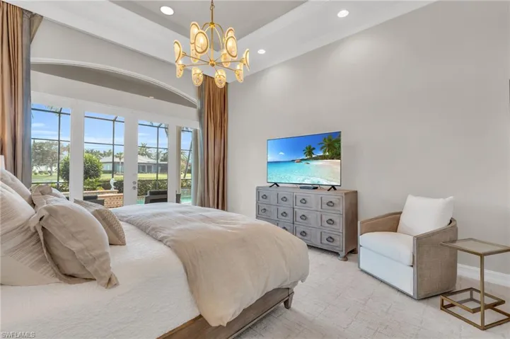 Bedroom featuring a chandelier