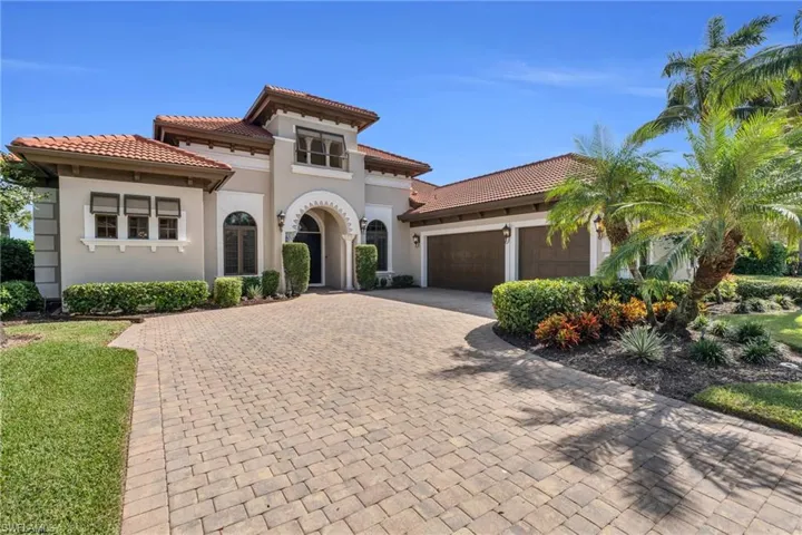 Mediterranean / spanish house featuring a garage