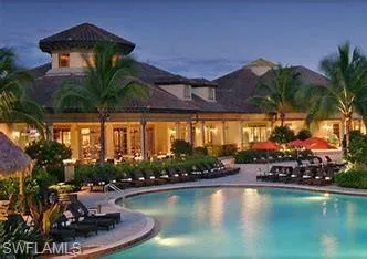 Pool at dusk with a patio