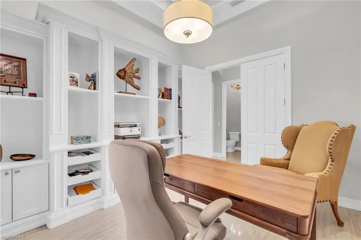 Office space featuring light hardwood / wood-style floors