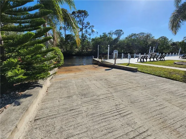 Surrounding community featuring a water view