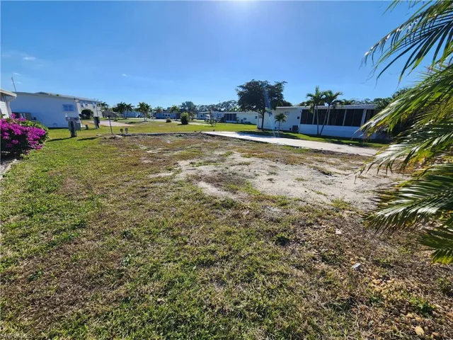 View of yard featuring a sunroom