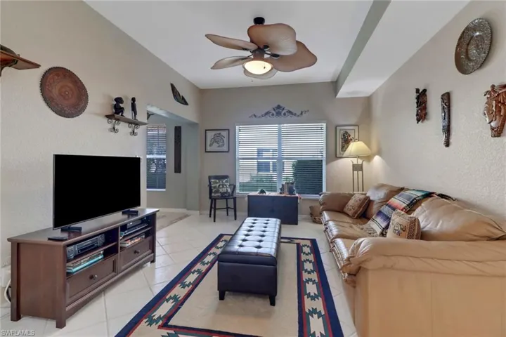 Tiled living room with ceiling fan