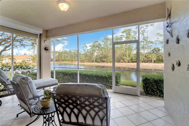 Sunroom with a water view