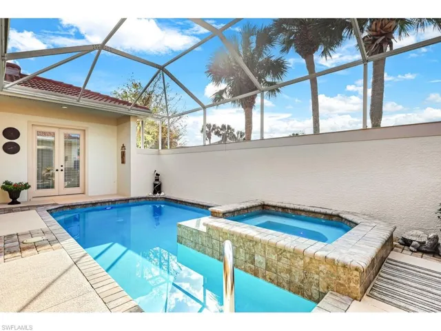 View of pool featuring a patio area, french doors to cabana/guest bedroom