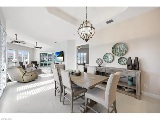 Dining area featuring a tray ceiling