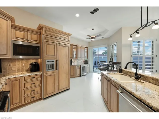 Kitchen featuring upgraded appliances and cabinets