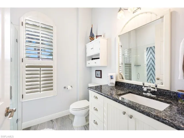 Cabana bath with vanity, an enclosed newly redone shower.