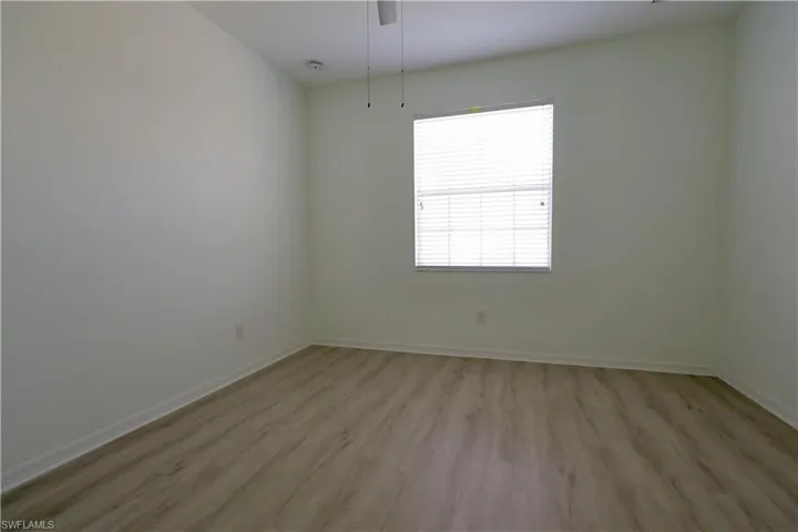 Empty room featuring light wood-style flooring and baseboards