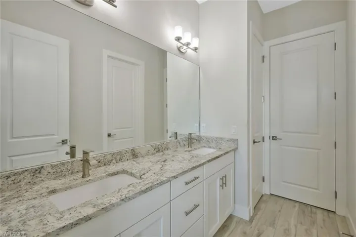 Jack and Jill Bathroom separates two guest bedrooms.