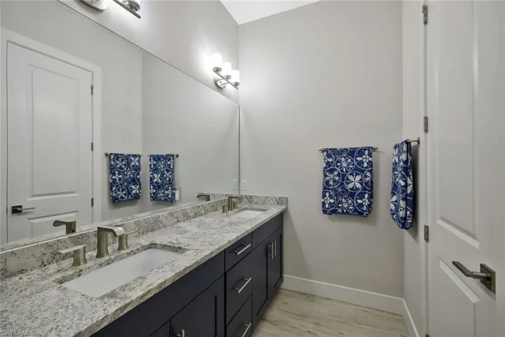 Primary Bath with duel sinks and separated watercloset.