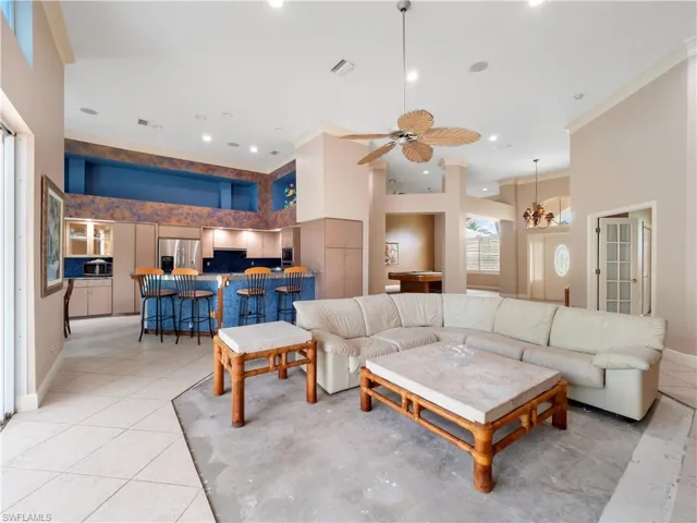 With approximately 13-foot ceilings and generous room dimensions, this living area provides the perfect foundation for a modern transformation.