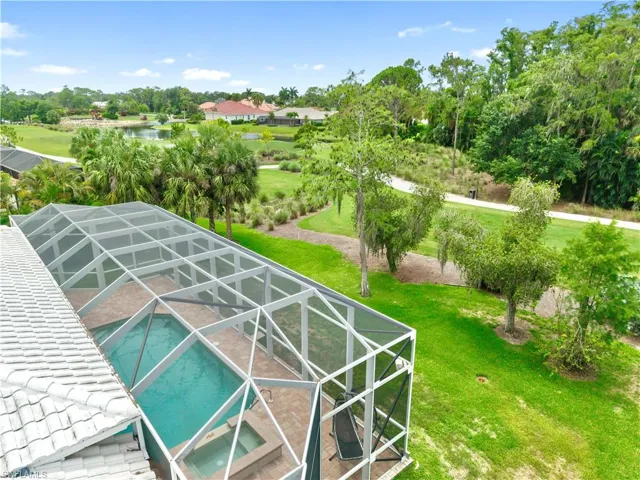 Poolside views highlight the unique character of this oversized homesite, offering golf course frontage without the typical exposure to neighboring backyards.