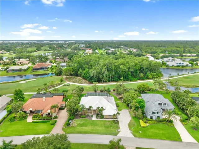 Aerial view showcasing the home's premium location overlooking the 13th hole of the renowned Loch Ness Golf Course, offering exceptional privacy, mature landscaping, and one of the most desirable golf course settings in Fiddlesticks Country Club.