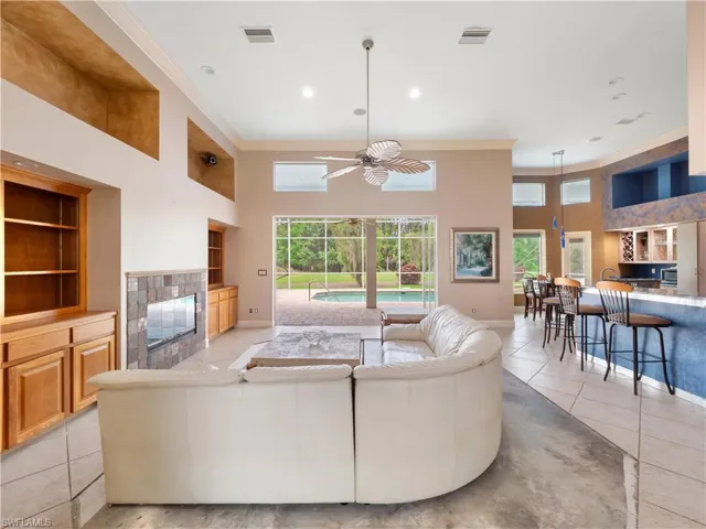 Large open living space with soaring ceilings and flexible design possibilities, allowing buyers to create a style uniquely their own.