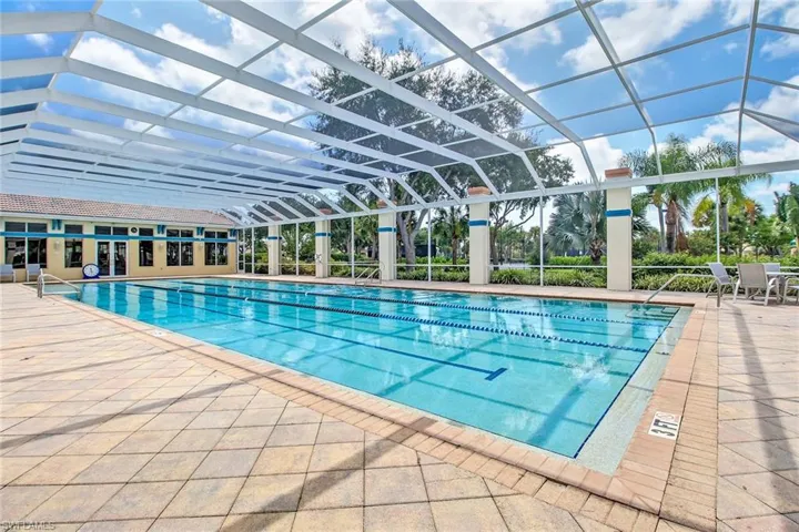 View of pool with a lanai and a patio area