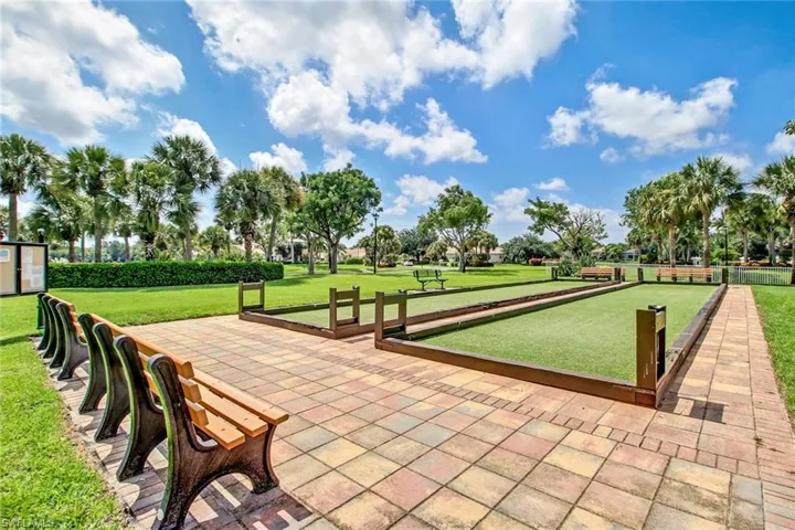 View of home's community with a lawn
