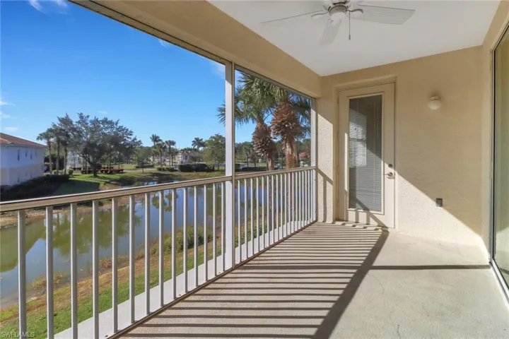 Balcony with ceiling fan and a water view