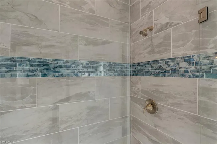 Bathroom featuring tiled shower
