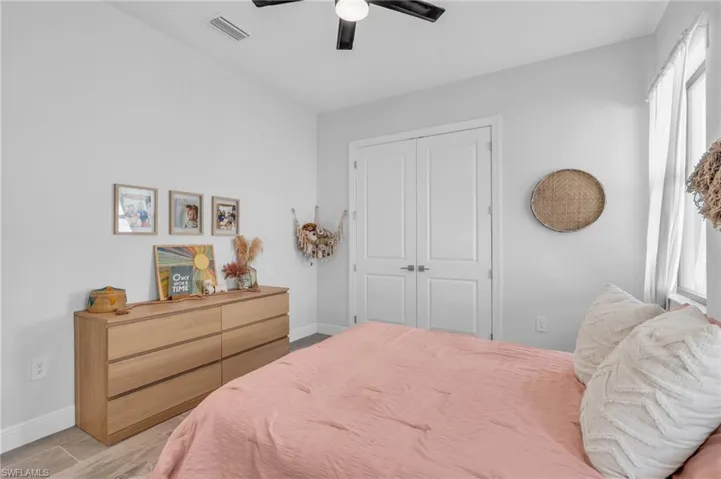 Bedroom featuring a closet and ceiling fan