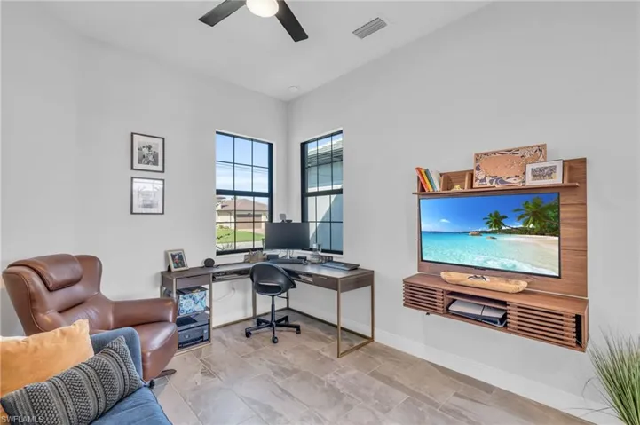 Home office featuring ceiling fan