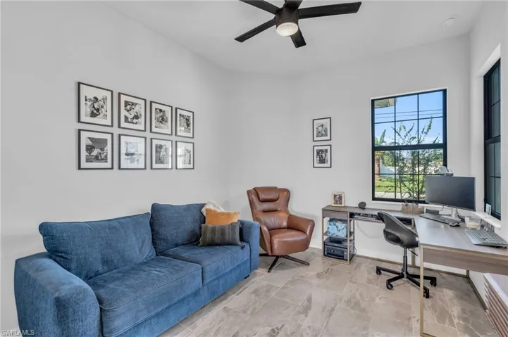 Home office featuring ceiling fan