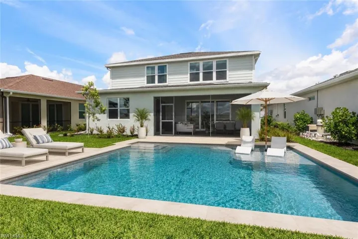 Expansive rectangular swimming pool with integrated sun shelf