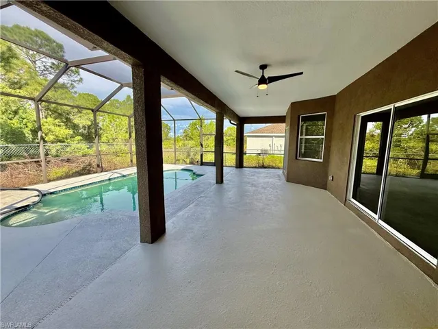 Covered rear porch overlooking the pool
