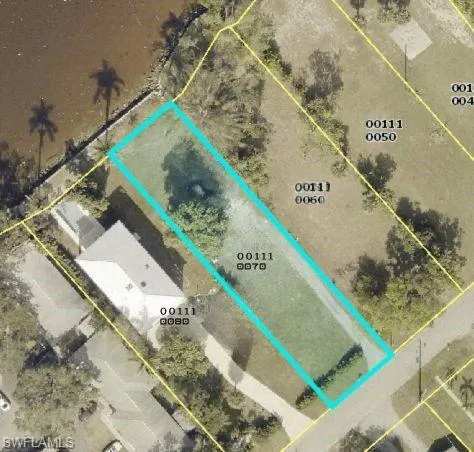 Aerial map of property and surrounding area with property parcel outlined