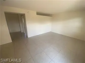 Empty room with tile patterned floors
