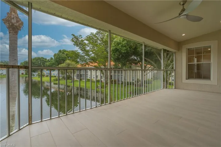 Large lanai featuring a water view and ceiling fan