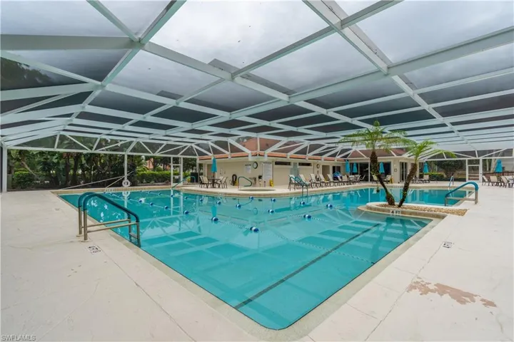 View of swimming pool with lap lanes and free swim area, hot tub/spa