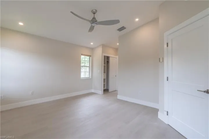 Primary suite, duel closets with custom shelving