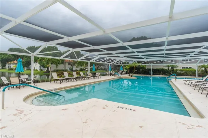View of screened swimming pool featuring a patio area